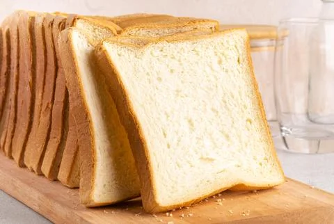 Stack of slice bread isolated on bright background. Close up. Stock Photos
