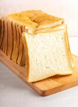 Stack of slice bread isolated on bright background. Close up. Stock Photos