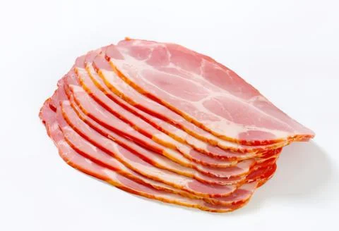 Stack of sliced bacon on white background Stock Photos