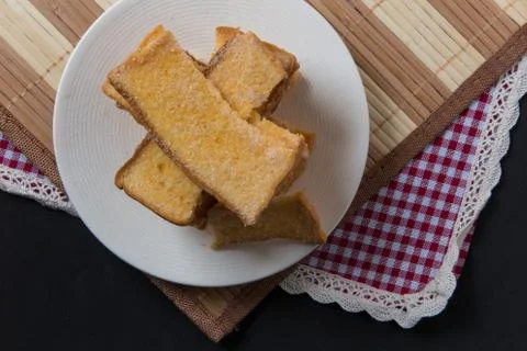 Stack of sliced crispy buttered bread with sugar Stock Photos
