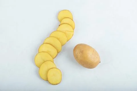 Stack of sliced potato on white background Foto stock