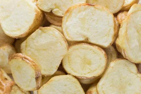 Stack of slices of potato chips, background Stock Photos
