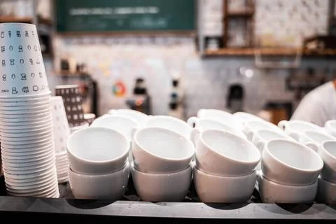 Stack of small ceramic cups on shelf. Stack of small ceramic cups on shelf... Foto stock