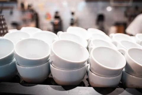 Stack of small ceramic cups on shelf. Stack of small ceramic cups on shelf... Foto stock