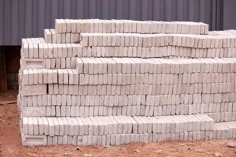 Stack of small concrete bricks for building Stock Photos