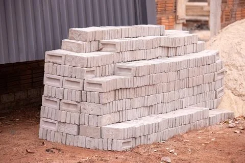 Stack of small concrete bricks for building Stock Photos