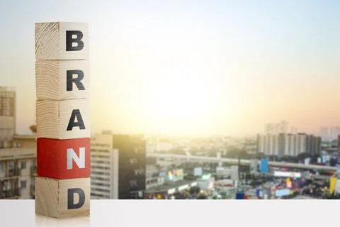 Stack of small wooden cubes with brand letters 스톡 사진