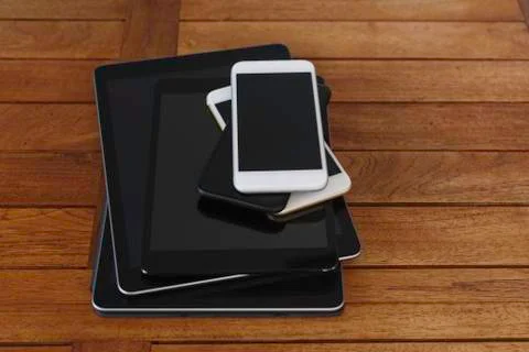 Stack of smart phones and digital tablets Foto stock
