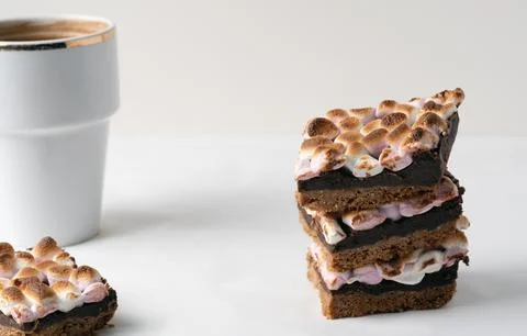 Stack of s'mores chocolate bars with a cup of coffee 写真素材