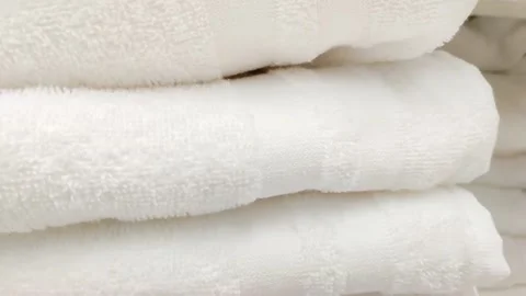 Stack of snow-white clean towels in the bathroom of five-star hotel apartment 스톡 동영상 220927154