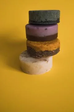 A stack of soap bars on a yellow background Stock Photos