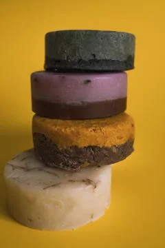 A stack of soap bars on a yellow background Stock Photos