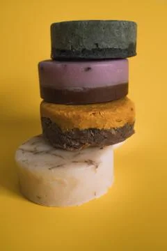 A stack of soap bars on a yellow background Stock Photos