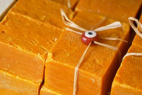 Stack of soap topped with evil eye beads, Stockfoto's