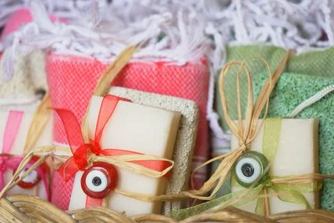 Stack of soap topped with evil eye beads, Foto stock