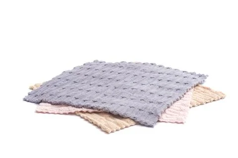 Stack of soft terry towels in pastel colors isolated on a white background... Foto stock