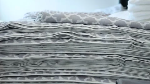 Stack of soft towels with gray-white patterns close-up, fabric with gray pattern Stock Footage 272897239
