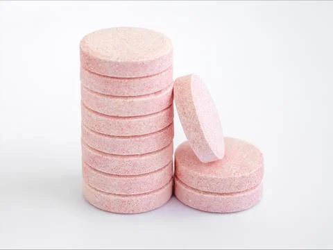 Stack of soluble effervescent vitamins with orange flavour. Stock Photos