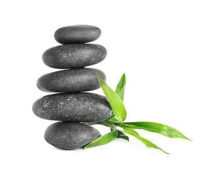 Stack of spa stones and bamboo sprout on white background 스톡 사진