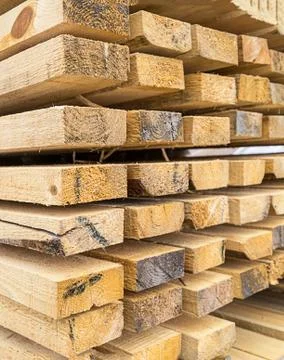 Stack of spiked symmetrical spruce boards wooden background smooth edge of th Stock Photos