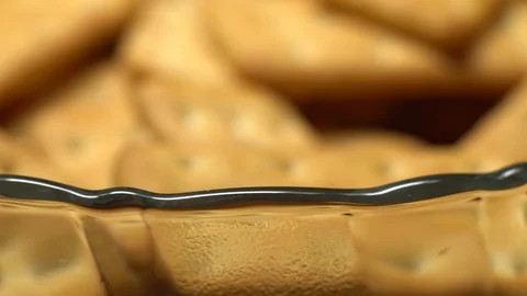 Stack of square crackers on a black background in rotation. Crackers spin. Stock Footage 99944890