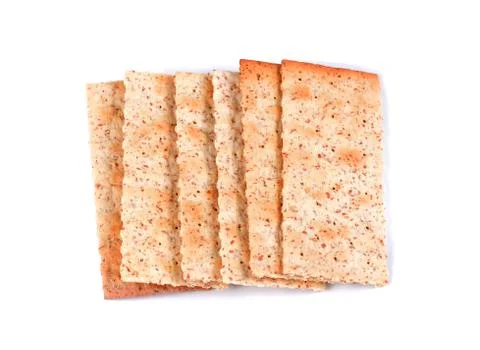 Stack of square crackers isolated on white background. Dry cracker cookies Stock Photos