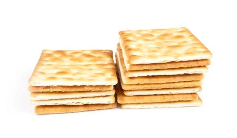 Stack of square crackers isolated on white background. Stock Photos