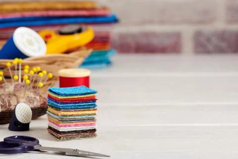 Stack of square pieces of colorful fabrics, accessories for quilting 스톡 사진