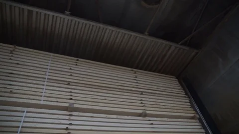 Stack of square wooden chips at construction yard. Dolly pan shot, blue sky Stock Footage 78721237