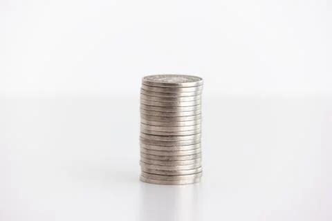 Stack of stainless metal generic currency coins set on table frontal shot iso Stock Photos