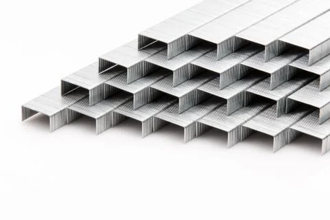 A stack of staples on a white background. Stock Photos