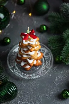 Stack of star shaped gingerbread cookies decorated with white icing and red.. Stock Photos