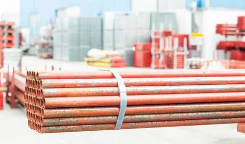Stack of steel tubes in stock. Stock Photos