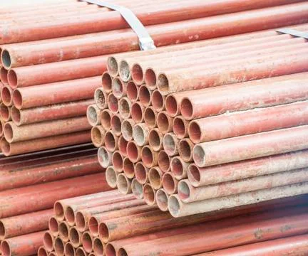 Stack of steel tubes in stock. Stock Photos