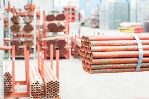 Stack of steel tubes in stock. Stock Photos