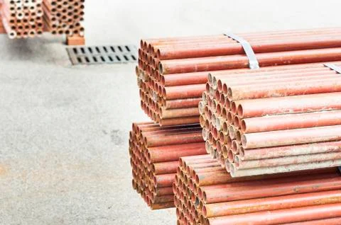 Stack of steel tubes in stock. Stock Photos