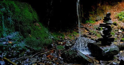 Stack of Stones at Amazing Jungle Waterfall Stock Footage 125773323