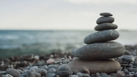 Stack of stones and Sea Splash Stock Footage 77553568