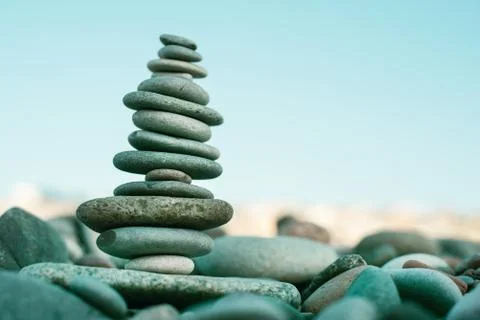 Stack of stones on beach - nature background. Concept balance Stock Photos