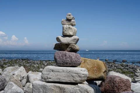 A stack of stones on a beach Stock Photos