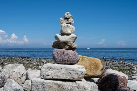 A stack of stones on a beach Stock Photos