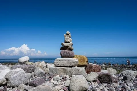 A stack of stones on a beach Stock Photos