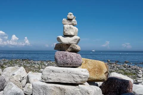 A stack of stones on a beach Stock Photos