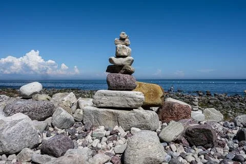 A stack of stones on a beach Stock Photos