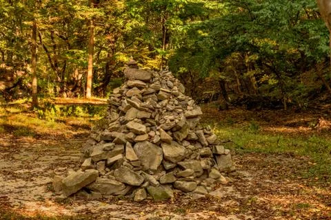 Stack of stones in forest glade Stock Photos