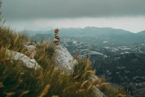 Stack of stones with mountains in the background Foto stock
