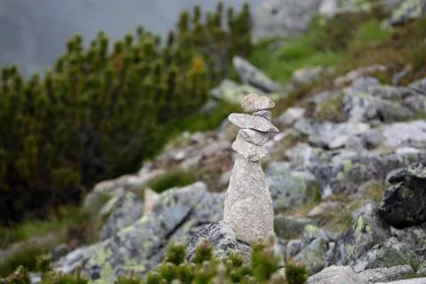 A stack of stones in the mountains. Stock Photos