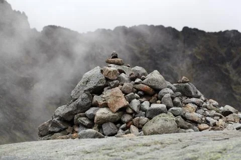 A stack of stones in the mountains. Stock Photos