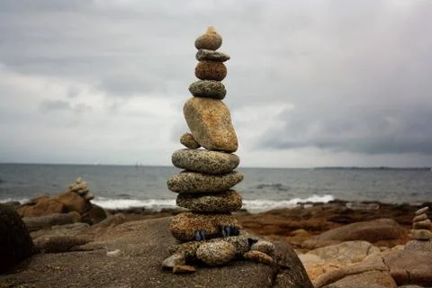 Stack of stones by the ocean Stock Photos
