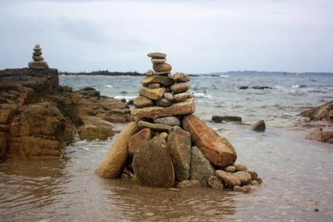 Stack of stones by the ocean Stock Photos